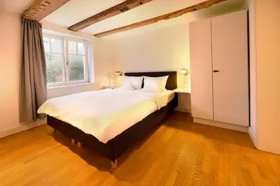 Ein Bett oder Betten in einem Zimmer der Unterkunft Der Charlottenhof