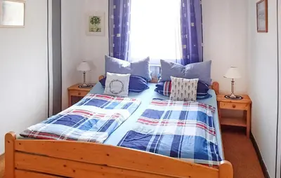 Ein Bett oder Betten in einem Zimmer der Unterkunft Ferienhaus Fuhlendorf