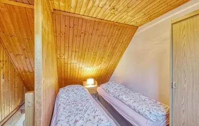 Ein Bett oder Betten in einem Zimmer der Unterkunft Ferienhaus Bodstedt