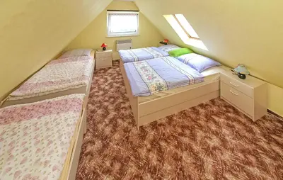 Ein Bett oder Betten in einem Zimmer der Unterkunft Ferienhaus Saal Ot Hessenburg