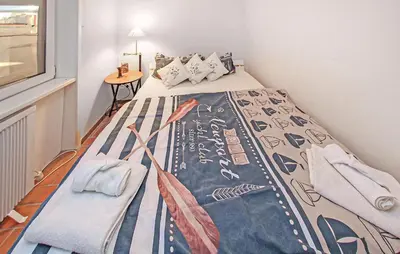 Ein Bett oder Betten in einem Zimmer der Unterkunft Ferienwohnung Prerow Ostseebad