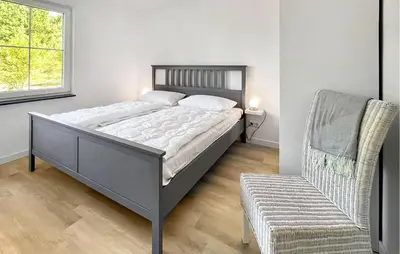 Ein Bett oder Betten in einem Zimmer der Unterkunft Ferienhaus Fuhlendorf