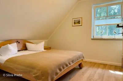 Ein Bett oder Betten in einem Zimmer der Unterkunft Haus Thea Appartement 02, 