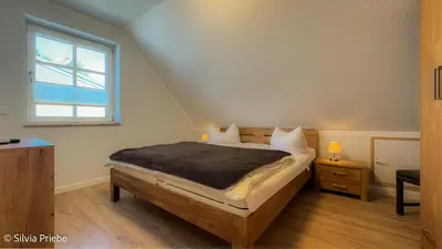 Ein Bett oder Betten in einem Zimmer der Unterkunft Haus Thea Appartement 03, 