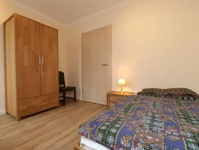 Ein Bett oder Betten in einem Zimmer der Unterkunft Haus Thea Appartement 03, 