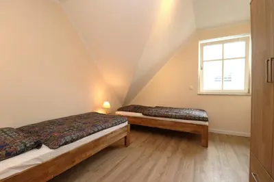 Ein Bett oder Betten in einem Zimmer der Unterkunft Haus Thea Appartement 03, 