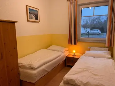 Ein Bett oder Betten in einem Zimmer der Unterkunft Zingst Wohnung 1 Darßer Weg 30a