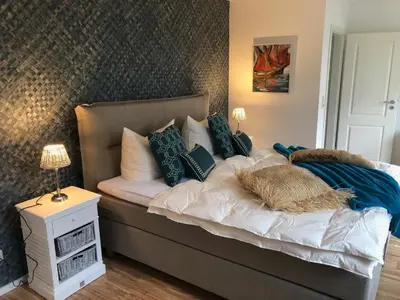 Ein Bett oder Betten in einem Zimmer der Unterkunft Ferienhaus Boddenblick mit Sauna