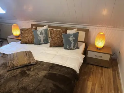 Ein Bett oder Betten in einem Zimmer der Unterkunft Ferienhaus Boddenblick mit Sauna