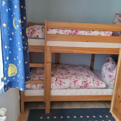 Ein Bett oder Betten in einem Zimmer der Unterkunft Ferienwohnung 