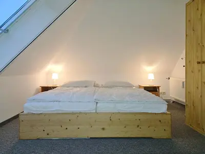 Ein Bett oder Betten in einem Zimmer der Unterkunft Zander FeWo 10