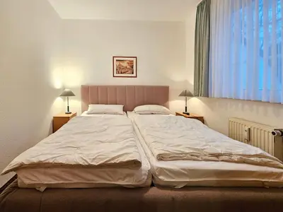 Ein Bett oder Betten in einem Zimmer der Unterkunft Zander FeWo 2