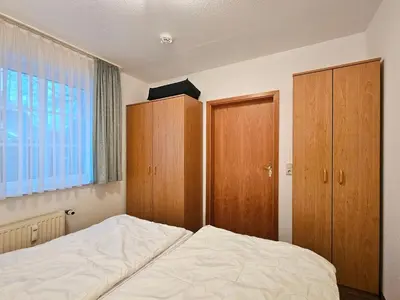Ein Bett oder Betten in einem Zimmer der Unterkunft Zander FeWo 2