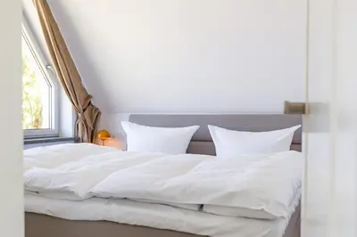 Ein Bett oder Betten in einem Zimmer der Unterkunft Haus ANNA
