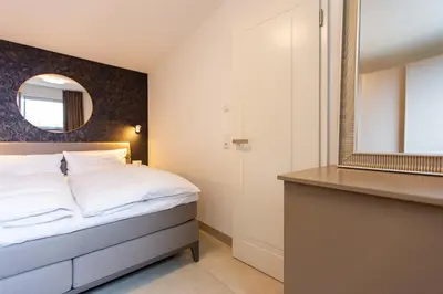Ein Bett oder Betten in einem Zimmer der Unterkunft Haus Anna Atelier