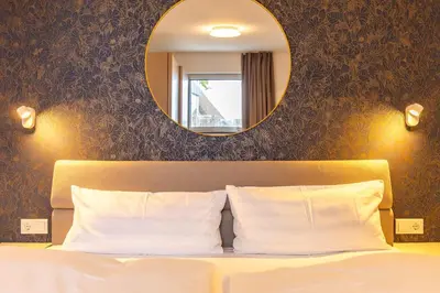 Ein Bett oder Betten in einem Zimmer der Unterkunft Haus Anna Atelier