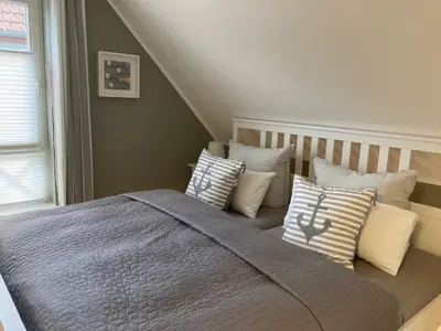 Ein Bett oder Betten in einem Zimmer der Unterkunft Haus Ostseezwilling 2