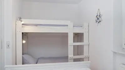Ein Bett oder Betten in einem Zimmer der Unterkunft Achtern Diek 12b - Wohnung 1