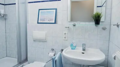 Ein Badezimmer in der Unterkunft Achtern Diek 12b - Wohnung 1