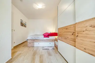 Ein Bett oder Betten in einem Zimmer der Unterkunft Haus Kranich 4 - Wohnung 17