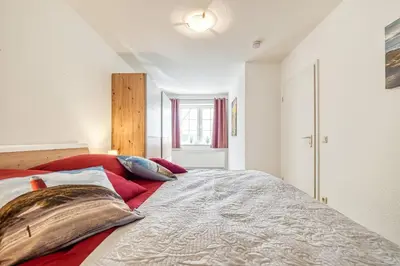 Ein Bett oder Betten in einem Zimmer der Unterkunft Haus Kranich 4 - Wohnung 17