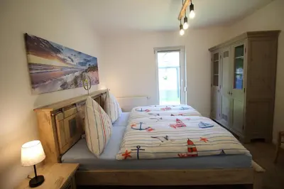 Ein Bett oder Betten in einem Zimmer der Unterkunft Deichperle-modern & ruhige Lage