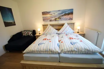 Ein Bett oder Betten in einem Zimmer der Unterkunft Deichperle-modern & ruhige Lage