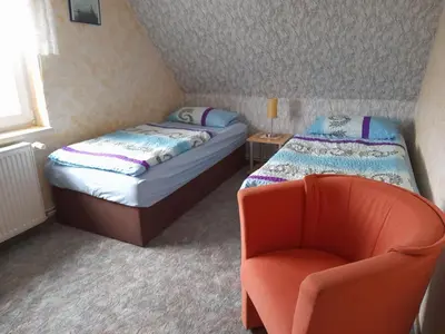 Ein Bett oder Betten in einem Zimmer der Unterkunft Ferienwohnung Sonnenuntergang
