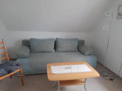 Ein Sitzbereich in der Unterkunft Ferienwohnung Sonnenuntergang
