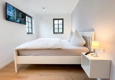 Ein Bett oder Betten in einem Zimmer der Unterkunft Meer genießen - Fewo Surfside