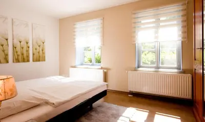 Ein Bett oder Betten in einem Zimmer der Unterkunft Haus zu den Büschen 03