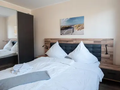 Ein Bett oder Betten in einem Zimmer der Unterkunft Strandstraße 16 - Wohnung 1