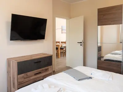 Ein Bett oder Betten in einem Zimmer der Unterkunft Strandstraße 16 - Wohnung 2