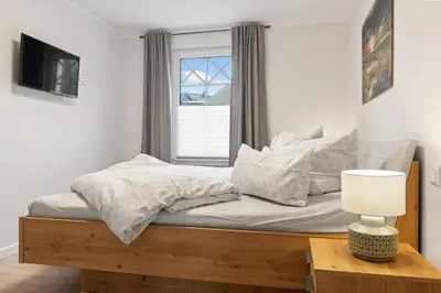 Ein Bett oder Betten in einem Zimmer der Unterkunft Rosenberg 43 Wg 6 1 Etage