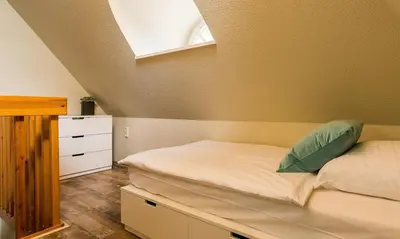 Ein Bett oder Betten in einem Zimmer der Unterkunft Krabbe