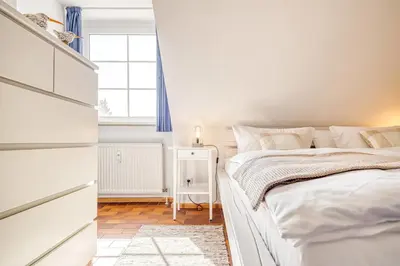 Ein Bett oder Betten in einem Zimmer der Unterkunft Kormoran B6