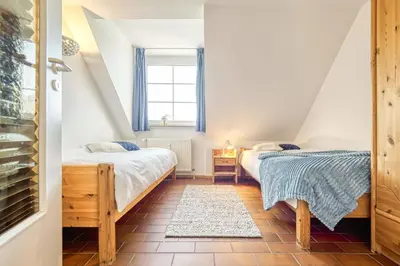 Ein Bett oder Betten in einem Zimmer der Unterkunft Kormoran B6