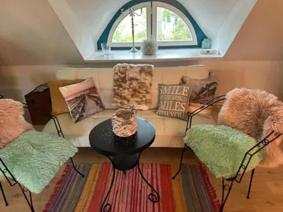 Ein Sitzbereich in der Unterkunft Studio Übersee