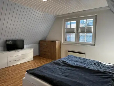 Ein Bett oder Betten in einem Zimmer der Unterkunft Prerower Seekiste Comfortable holiday residence