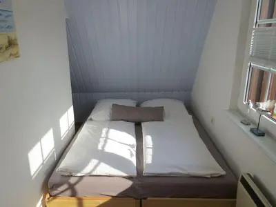 Ein Bett oder Betten in einem Zimmer der Unterkunft Prerower Seekiste Comfortable holiday residence