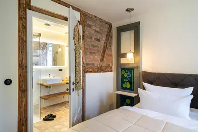Ein Bett oder Betten in einem Zimmer der Unterkunft Kapitänshaus 