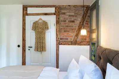 Ein Bett oder Betten in einem Zimmer der Unterkunft Kapitänshaus 