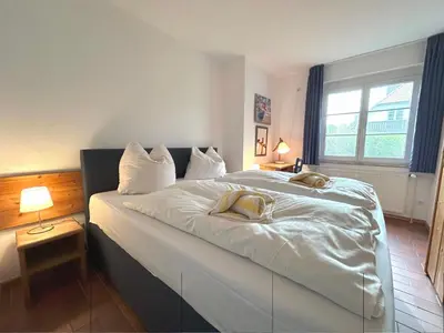 Ein Bett oder Betten in einem Zimmer der Unterkunft Resi L2
