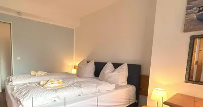 Ein Bett oder Betten in einem Zimmer der Unterkunft Resi L2
