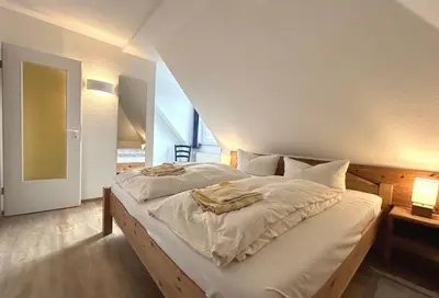 Ein Bett oder Betten in einem Zimmer der Unterkunft Resi M6