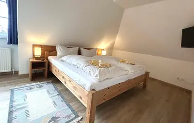 Ein Bett oder Betten in einem Zimmer der Unterkunft Resi M6