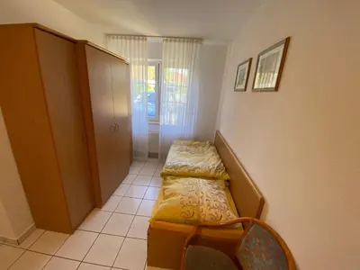 Ein Bett oder Betten in einem Zimmer der Unterkunft Fewo Kranich 36