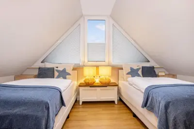 Ein Bett oder Betten in einem Zimmer der Unterkunft Störtebekers Perle