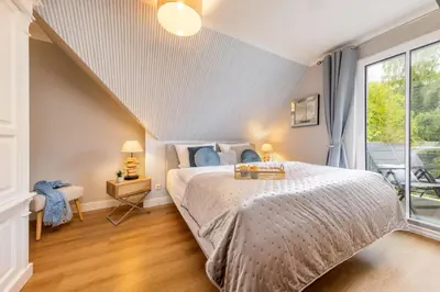 Ein Bett oder Betten in einem Zimmer der Unterkunft Störtebekers Perle
