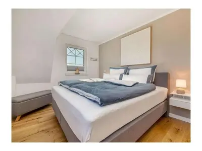 Ein Bett oder Betten in einem Zimmer der Unterkunft LieblingsPlatz Zingst